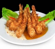 Camarones envueltos en coco con salsa de mango