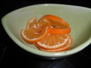 Cortar en rodajas la mandarina