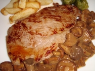 Gigot a la normanda con setas