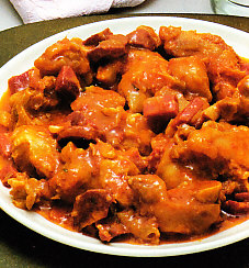 Manitas de cerdo con tomate