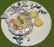 Merluza a la naranja en papillote