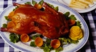 Pato asado con salsa de melao de caña y naranja