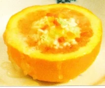 Receta de Naranjas rellenas de arroz y frutas en almíbar